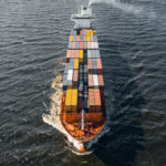 Aerial view of cargo ship with colorful containers. Square composition