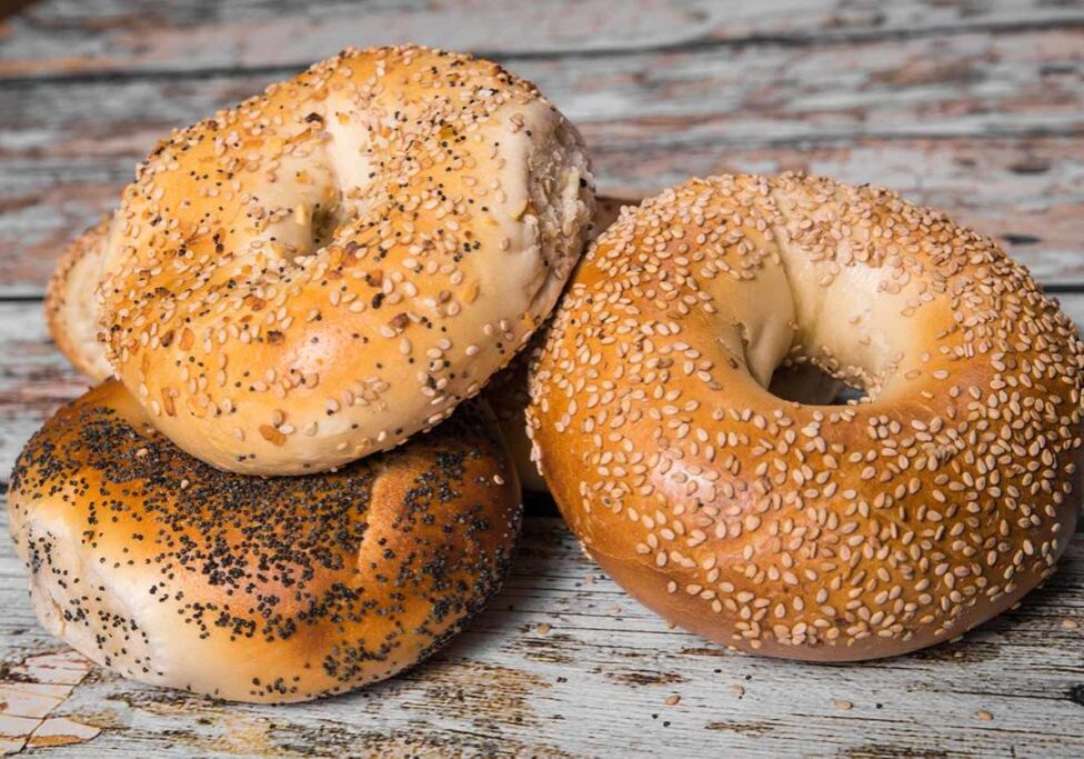 fresh bagels on wood background